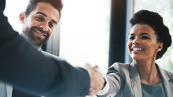 Conference room with a business handshake.